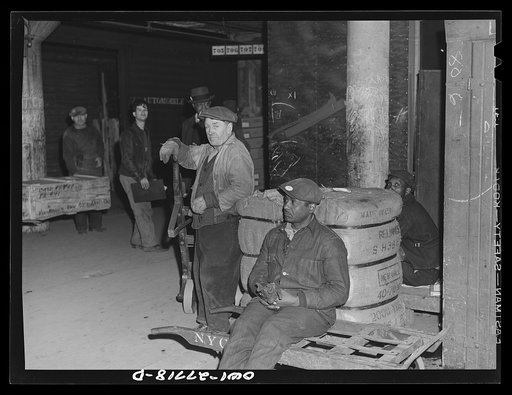 Chicago, Illinois. Freight handlers resting during the lunch period at the United States Army consolidating station