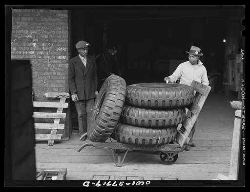 Chicago, Illinois. Checking tires that have just been unloaded from a truck at the United States Army consolidating station