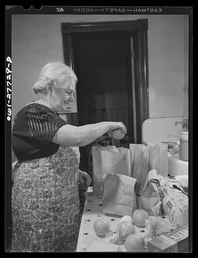 Niagara Falls, New York. Mrs. Hannegan runs a boardinghouse from six to ten girls working in war plants. Fixing lunches for them to take to work