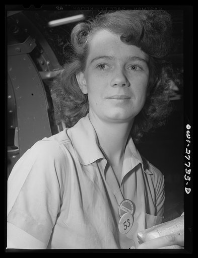 Bell Aircraft Corp. Niagara Falls, New York. Riveter on the final assembly line of Bell Airacobras