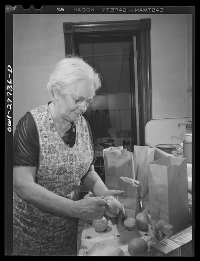 Niagara Falls, New York. Mrs. Hannegan, who runs a boardinghouse for from six to ten girls working in war plants, fixing lunches for them to take to work