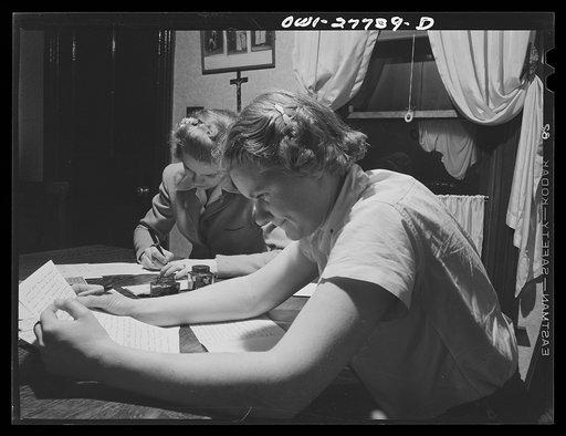 Niagara Falls, New York. Nan Hannegan, a nineteen-year old chemical operator at the Niacet chemical company, and a friend writing letters