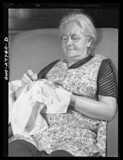 Niagara Falls, New York. Mrs. Hannegan, who runs a boardinghouse for girls who work in war plants, sewing