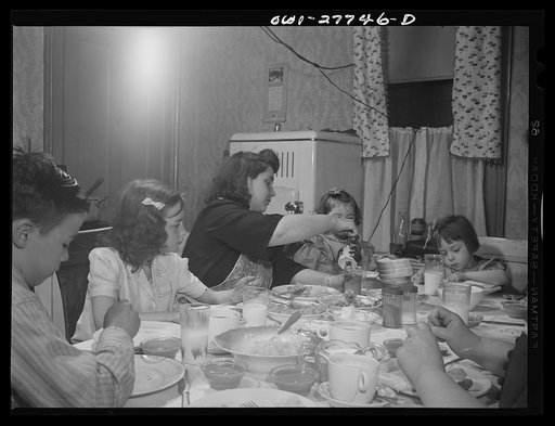 Buffalo, New York. The Grimm family eating Sunday dinner. Mrs. Grimm, a twenty-six year old widow, is a crane operator at Pratt and Letchworth. The two youngest children live in a foster home during the week