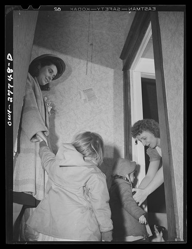 Buffalo, New York. Mrs. Grimm, (left), a widow of twenty-six with six children under twelve, is a crane operator at Pratt and Letchworth. Her two youngest children, Carol, five, and Mona, two, live in a foster home during the week. They come home on Sundays. Here, Mrs. Grimm is bringing them back to