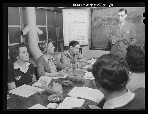Untitled photo, possibly related to: Bell Aircraft Corporation, Niagara Falls, New York. An upgrading class for employees. Most promising employees are chosen from the production line for special instruction in supervision and are given an opportunity for advancement
