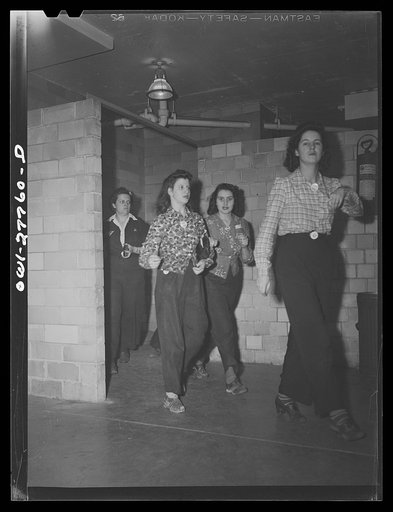 Untitled photo, possibly related to: Bell Aircraft Corporation, Niagara Falls, New York. Women going to work at 4:30 p.m.