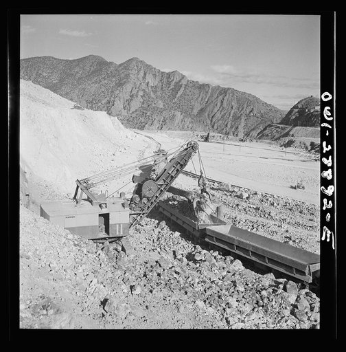 Morenci, Arizona. Loading copper ore from an open-pit mine into ore cars which transport the ore to the smelter plant at the Phelps Dodge mining corporation