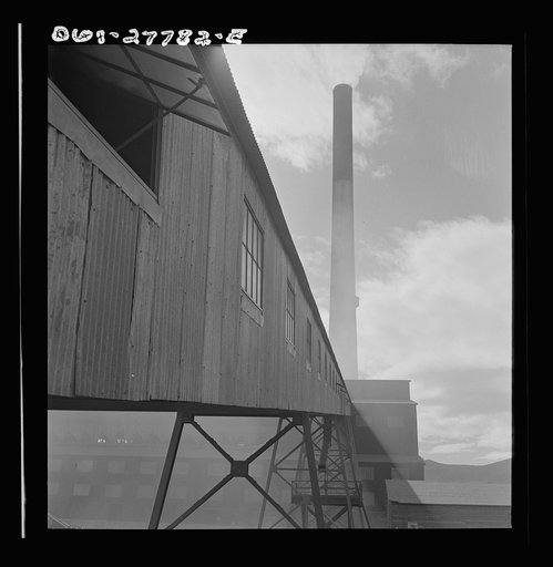 Untitled photo, possibly related to: Morenci, Arizona. Conveyor galleries where ore is transported to the smelter plant in the background