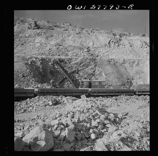 Untitled photo, possibly related to: Morenci, Arizona. Loading copper ore from an open-pit copper mine