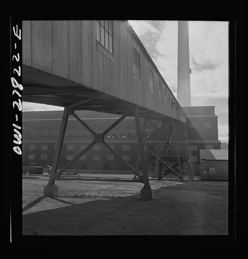 Morenci, Arizona. Conveyor galleries where ore is transported to the smelter plant in the background