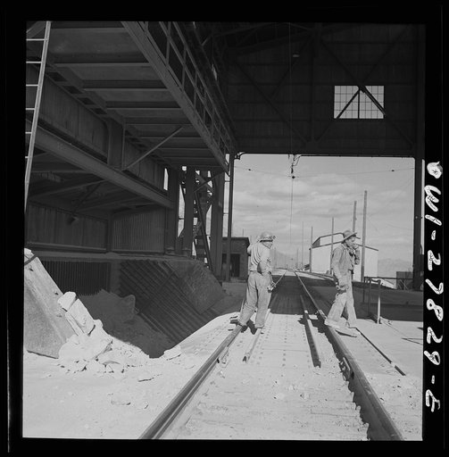 Untitled photo, possibly related to: Morenci, Arizona. Entrance to the copper concentrator of the Phelps Dodge mining corporation where ore trains transport copper ore from the open-pit mine