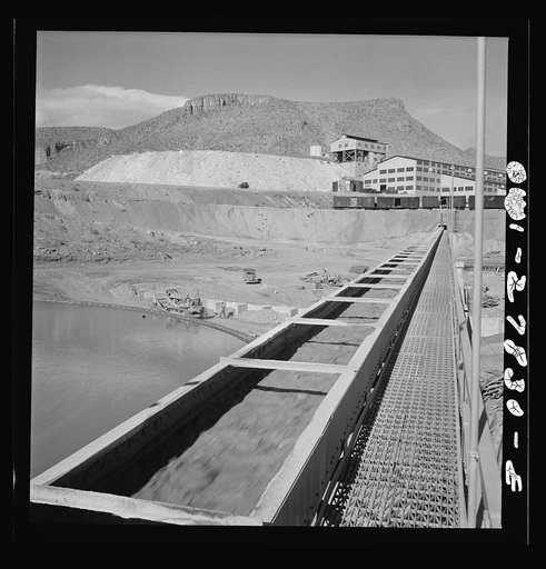Untitled photo, possibly related to: Morenci, Arizona. Conveyor gallery where the copper is taken to the smelter, as shown in the background