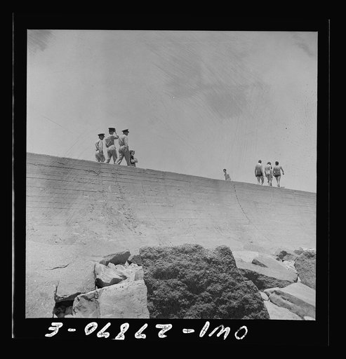 Untitled photo, possibly related to: Galveston, Texas. Three sailors walking along the seawall