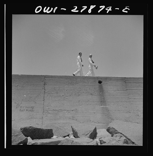 Galveston, Texas. Two sailors walking along the seawall