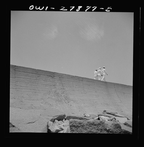 Galveston, Texas. Three sailors walking along the seawall