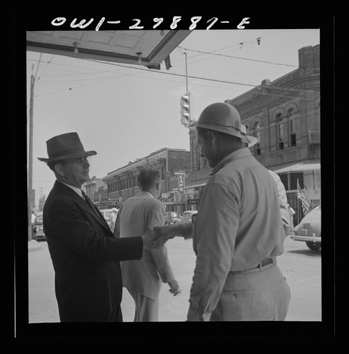 Untitled photo, possibly related to: Orange, Texas. Shipyard worker talking with two friends