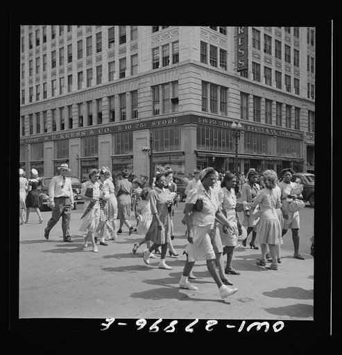 Houston, Texas. People crossing a downtown street with the green light