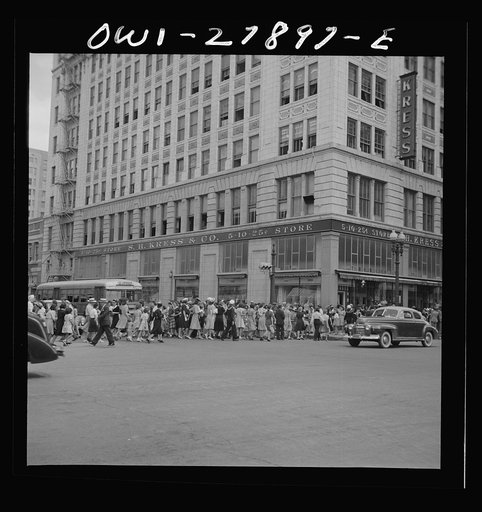 Houston, Texas. People crossing a downtown street with the green light