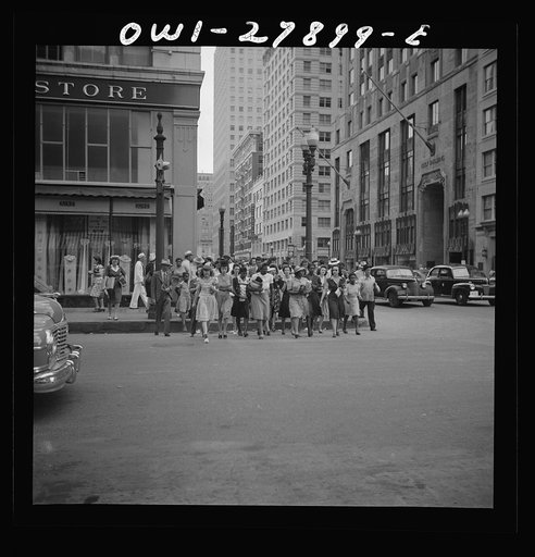 Houston, Texas. People crossing a downtown street with the green light