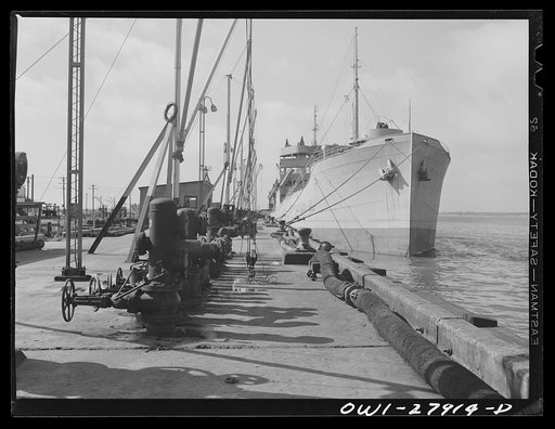 Baytown, Texas. Tanker which is being loaded with oil at a refinery