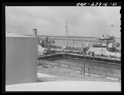 Untitled photo, possibly related to: Tanker which is being loaded with oil at a refinery. Baytown, Texas