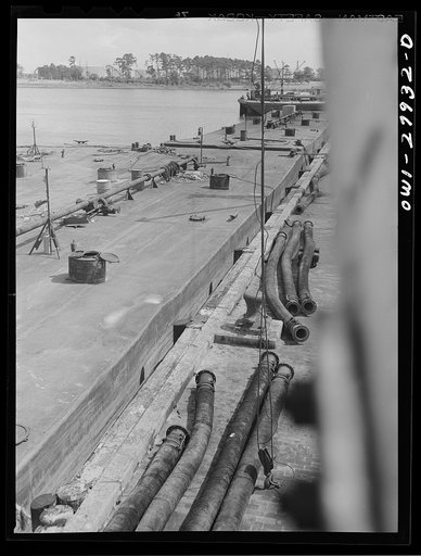 Untitled photo, possibly related to: Baytown, Texas. Barges to be loaded with oil at a refinery