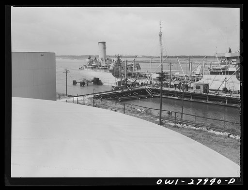 Tanker which is being loaded with oil at a refinery. Baytown, Texas