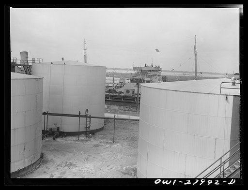 Untitled photo, possibly related to: Tanker which is being loaded with oil at a refinery. Baytown, Texas