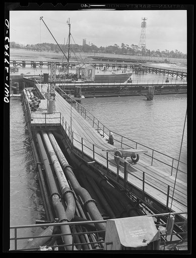 Baytown, Texas. Pipelines leading to a barge loading dock at a refinery