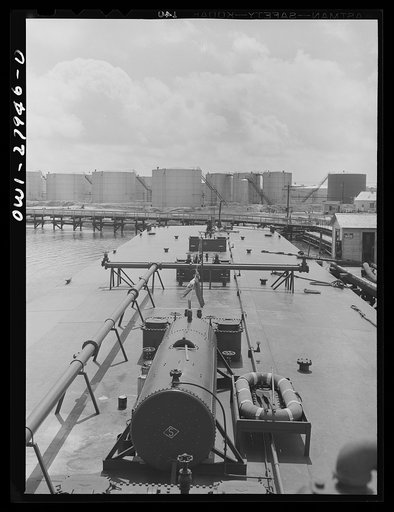 Baytown, Texas. Barge at a refinery to be loaded with oil