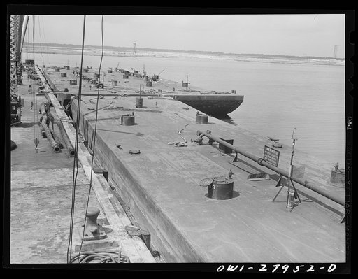 Baytown, Texas. Barges to be loaded with oil at a refinery