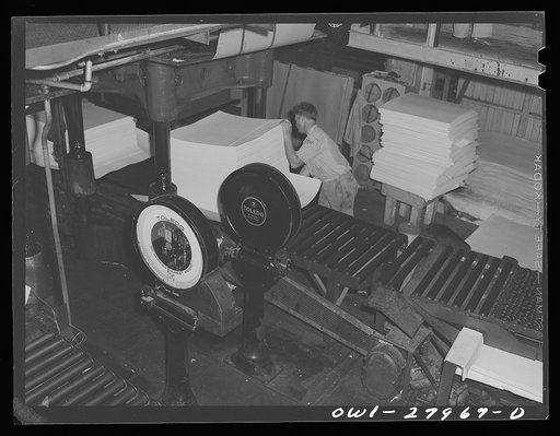 Untitled photo, possibly related to: Houston, Texas. Weighing sheets of Kraft (chemical) paper at the Champion paper mill