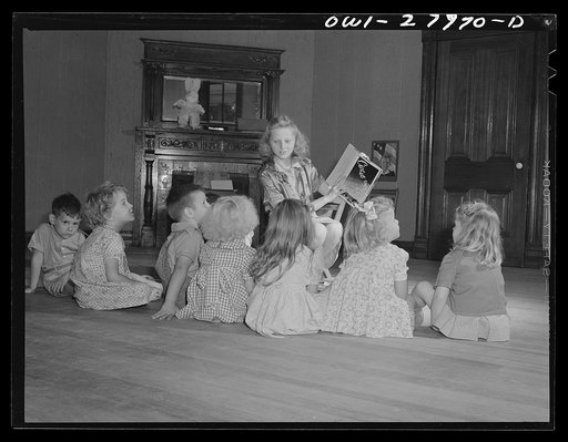 Orange, Texas. This high school girl in training for nursery school work spends an hour daily with children of shipyard workers in the "laboratory" nursery school