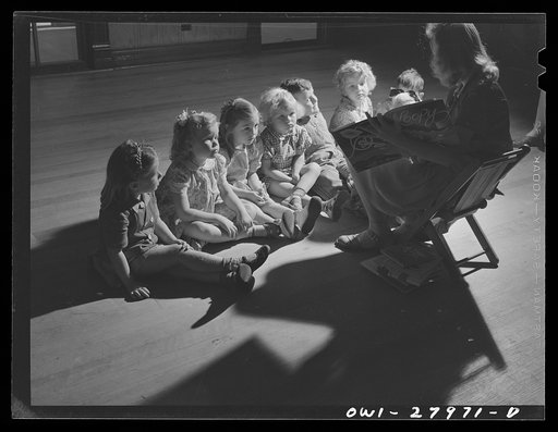 Orange, Texas. This high school girl in training for nursery school work spends an hour daily with children of shipyard workers in the "laboratory" nursery school