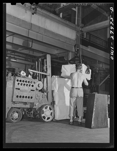 Houston, Texas. Loading a truck at the Champion paper company with bundles of Kraft chemical pulp to load on a freight car