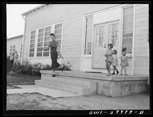 Untitled photo, possibly related to: Orange, Texas. Mother who works in the shipyard calling for her son at the nursery school at 6 p.m.