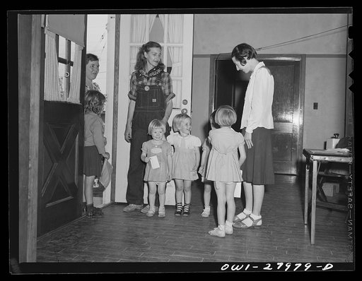 Orange, Texas. Mother who works in the shipyard calling for her daughter at the nursery school at 6 p.m.
