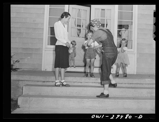 Orange, Texas. Mother who works in the shipyard calling for her son at the nursery school at 6 p.m.