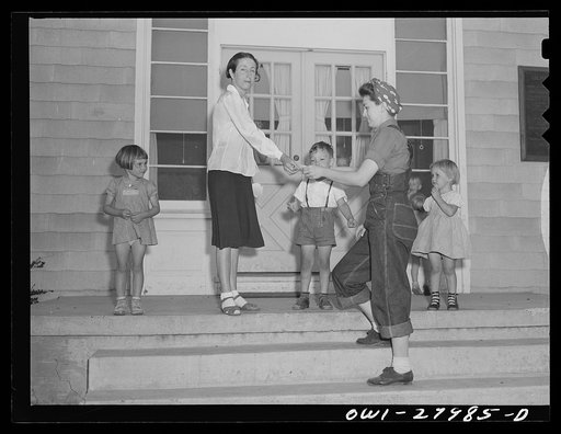Untitled photo, possibly related to: Orange, Texas. Mother who works in the shipyard calling for her son at the nursery school at 6 p.m.