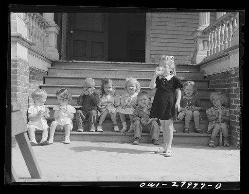 Orange, Texas. Nursery school children having orange juice in the middle of the morning