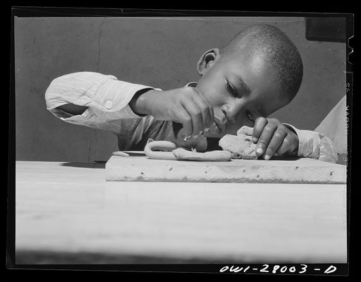 Orange, Texas. Negro boys whose parents are both employed, modeling in clay at a nursery school