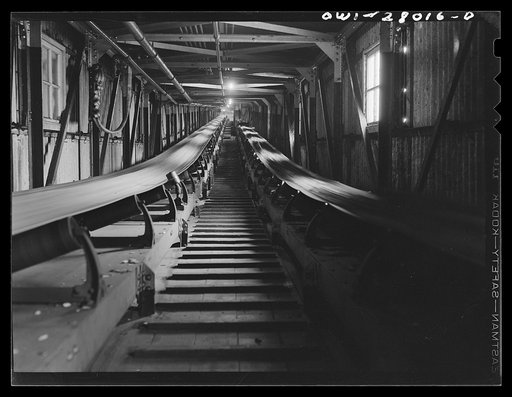 Houston, Texas. Conveyor carrying groung wood pulp to the paper machine at the Champion paper mill