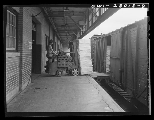 Houston, Texas. Loading freight car with Kraft (chemical) pulp at the Champion paper mill