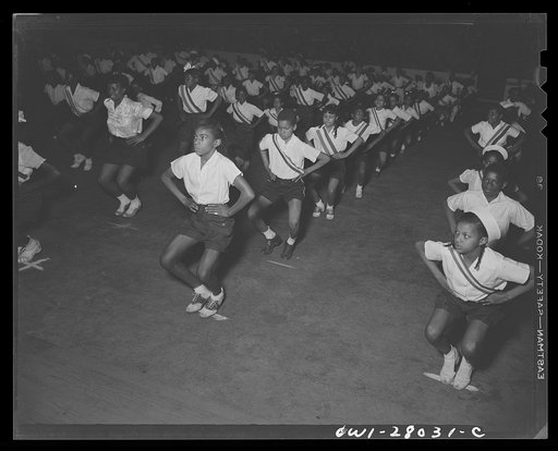Untitled photo, possibly related to: Washington, D.C. With "Victory through good health" as a slogan, Negro schools held a show at the Uline arena stressing the importance of physical fitness in wartime and demonstrating their physical education programs. Fourth and fifth grade children take part in