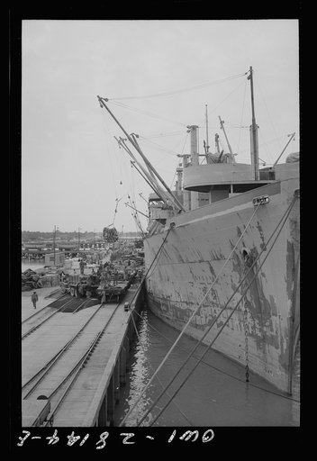 Supplies for Russia being unloaded from American freighters somewhere in the Middle East