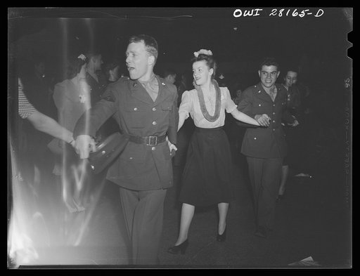Untitled photo, possibly related to: Buffalo, New Yorl. Young Women's Christian Association (YWCA) coeducational recreation program for the third shift and swing shift workers from 9 a.m. to 1 and midnight to 5 a.m. includes sports, singing and dancing