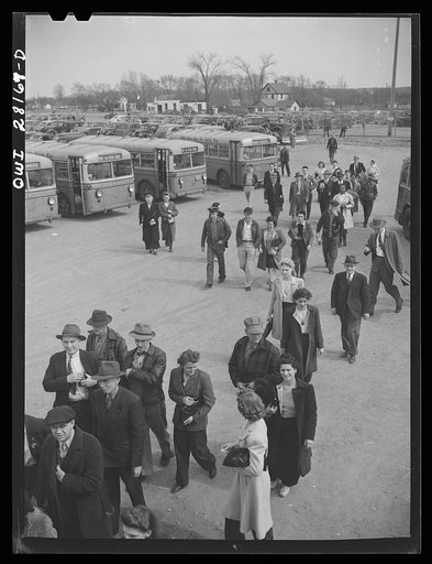 Niagara Falls, New York. Workers arriving on buses and in cars for the 4:30 p.m. shift to work in the Bell Aircraft plant