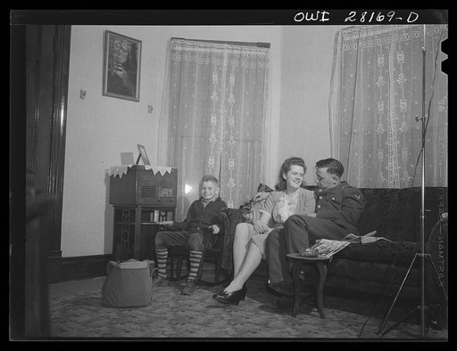 Niagara Falls, New York. One of the war workers living at Mrs. Hannegan's boardinghouse entertaining a friend