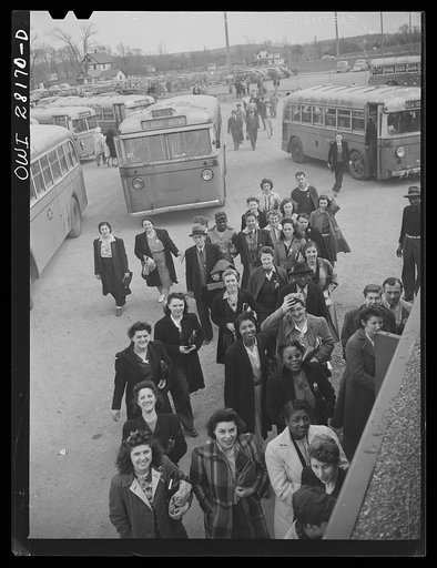 Niagara Falls, New York. Workers arriving on buses and in cars for the 4:30 p.m. shift at the Bell Aircraft plant